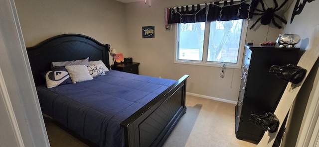 bedroom featuring baseboards and carpet floors