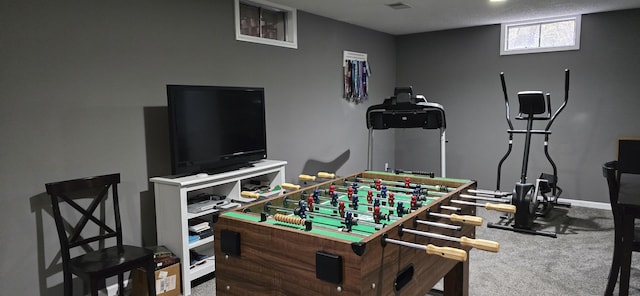 game room with baseboards and carpet floors