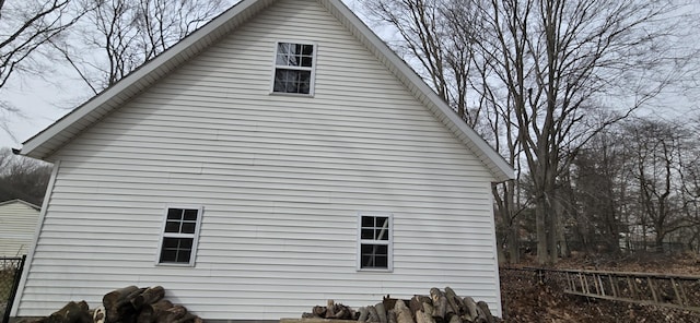 view of side of property with fence