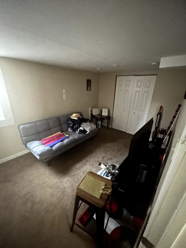 living room featuring baseboards and carpet flooring