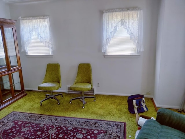 sitting room featuring carpet flooring, baseboards, and visible vents