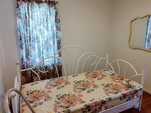 bedroom with wood finished floors