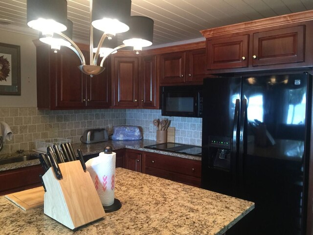 kitchen with tasteful backsplash, black appliances, and ornamental molding