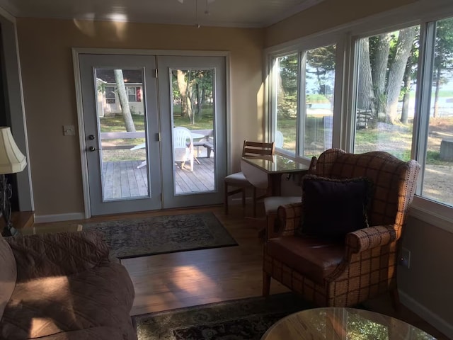 entryway featuring baseboards and wood finished floors