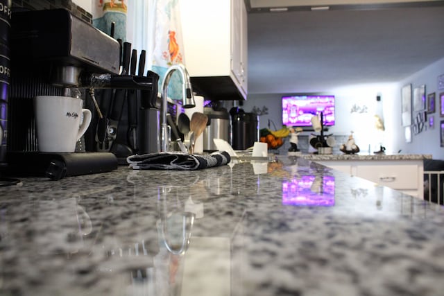 kitchen featuring white cabinets