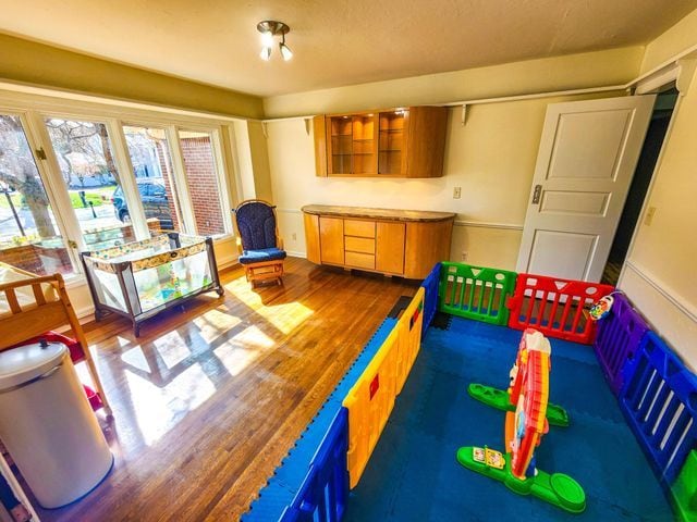 game room with wood finished floors