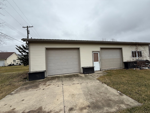 garage with concrete driveway