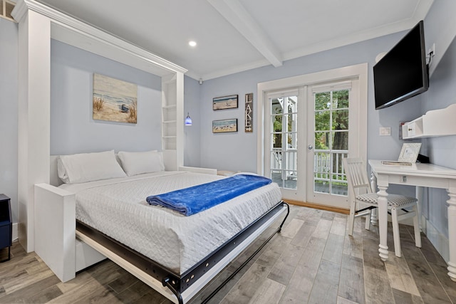 bedroom with light wood finished floors, beamed ceiling, ornamental molding, and access to outside