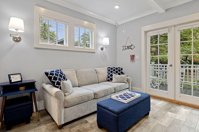 living area with beamed ceiling, wood finished floors, recessed lighting, crown molding, and baseboards