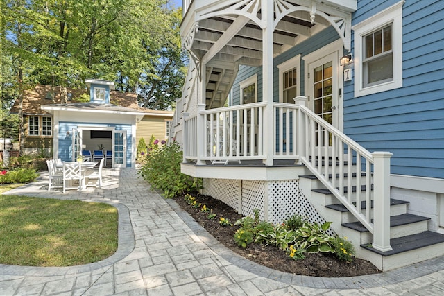 view of exterior entry with a porch