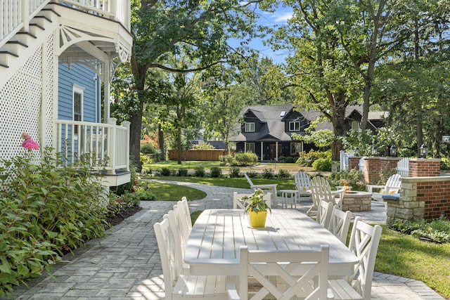 view of patio featuring outdoor dining area and an outdoor fire pit