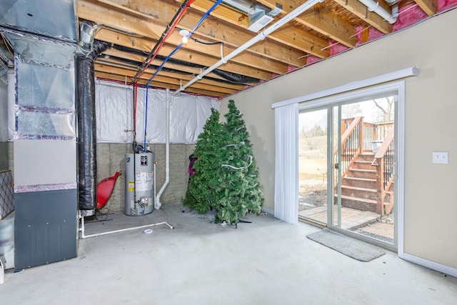 below grade area featuring water heater and heating unit