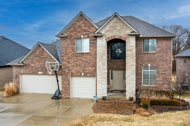 traditional-style home with stone siding, a shingled roof, brick siding, and concrete driveway