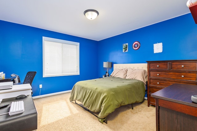 carpeted bedroom with baseboards