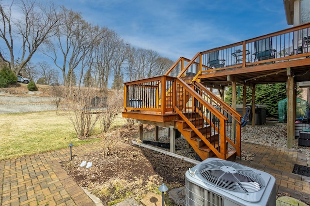 exterior space featuring a patio area, central AC unit, a deck, and stairs