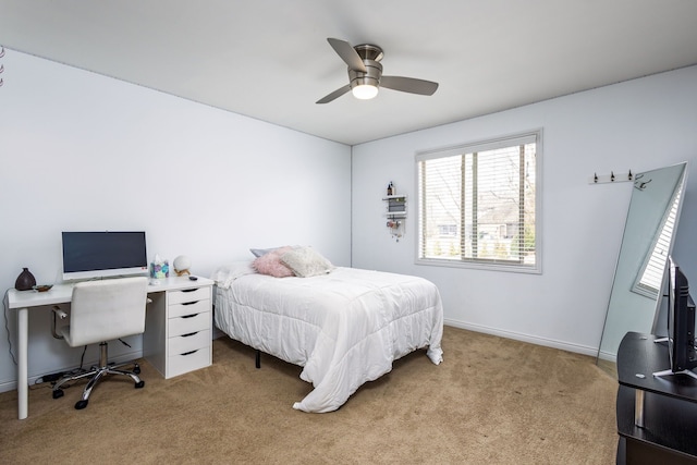carpeted bedroom with baseboards and a ceiling fan