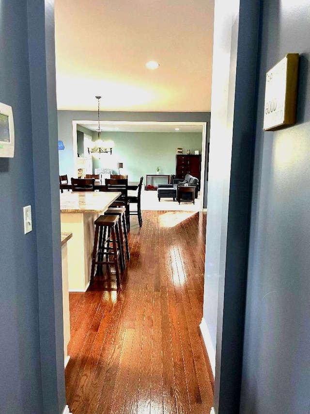 hallway featuring dark wood-style floors and recessed lighting