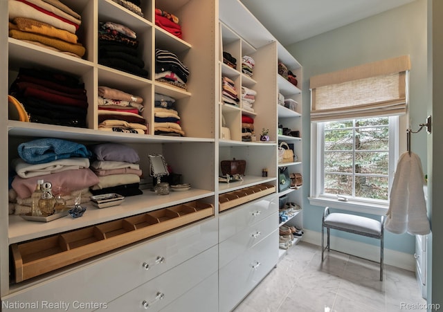6654 College Park, Clarkston, MI 48346 - spacious closet featuring light marble finish floors