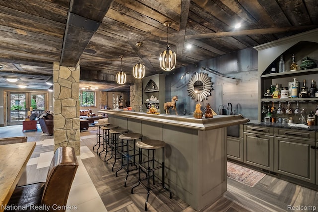 6654 College Park, Clarkston, MI 48346 - indoor wet bar featuring wooden ceiling with exposed beams, decorative columns, and hanging light fixtures