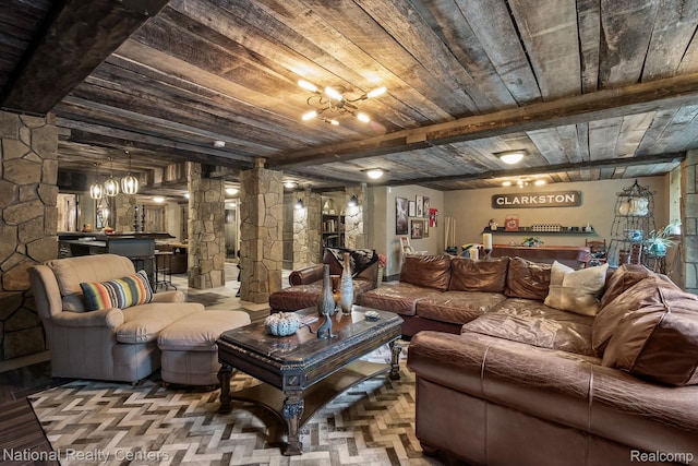 6654 College Park, Clarkston, MI 48346 - living area featuring wooden ceiling with exposed beams, ornate columns, and a chandelier