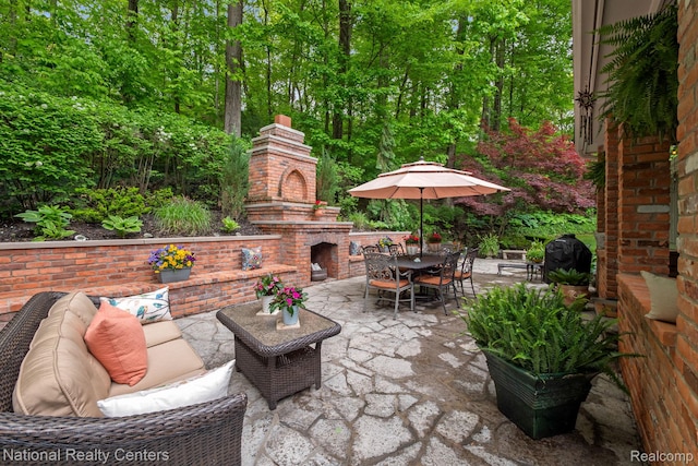 6654 College Park, Clarkston, MI 48346 - view of patio featuring outdoor dining area, grilling area, and an outdoor living space with a fireplace