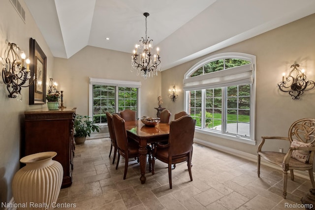 6654 College Park, Clarkston, MI 48346 - dining area with a chandelier, stone tile flooring, plenty of natural light, and vaulted ceiling