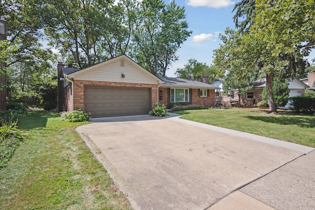 ranch-style home featuring brick siding, an attached garage, a chimney, and concrete driveway