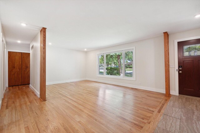 foyer entrance featuring recessed lighting, visible vents, baseboards, and light wood-style floors