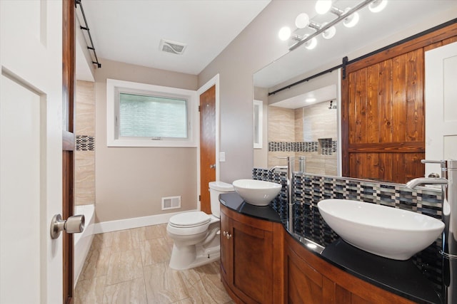 bathroom featuring a sink, visible vents, and walk in shower