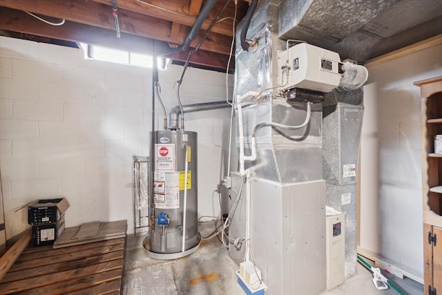 utility room featuring gas water heater and heating unit