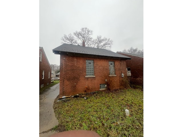 view of property exterior featuring brick siding