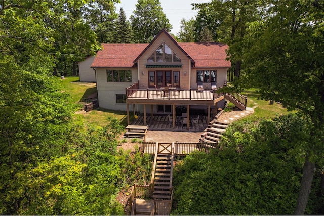 7107 Hallenbeck Hwy, Manitou Beach, MI 49253 - rear view of house with stairs, a deck, a patio, and roof with shingles