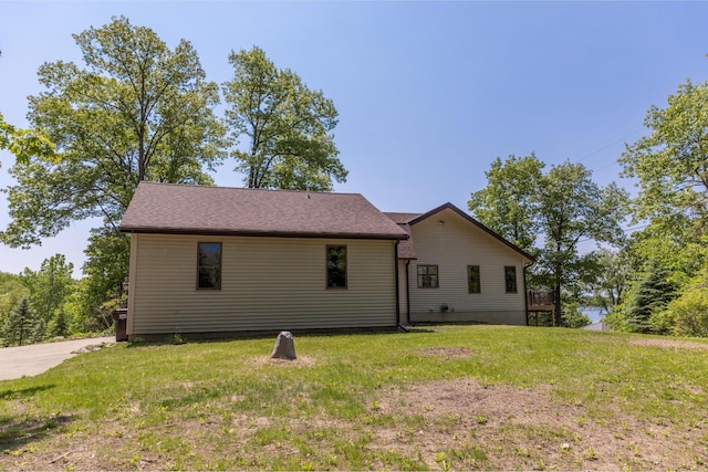 7107 Hallenbeck Hwy, Manitou Beach, MI 49253 - rear view of house with a lawn