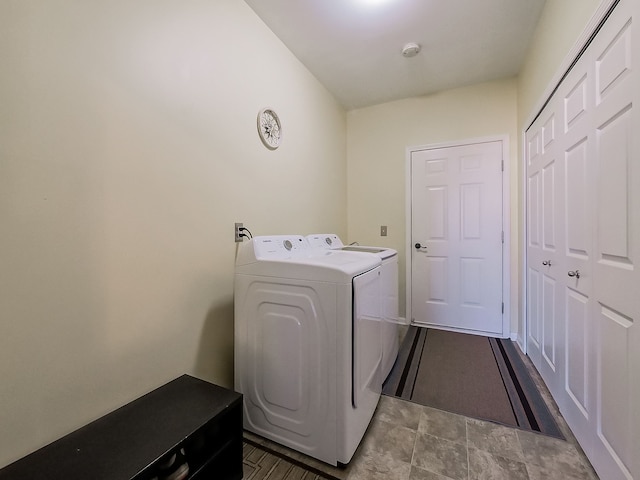 laundry room featuring washer and clothes dryer and laundry area