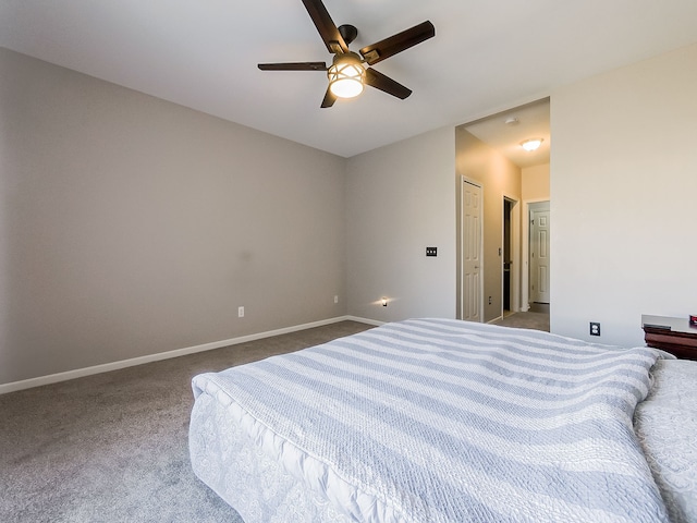 bedroom with baseboards, carpet floors, and a ceiling fan