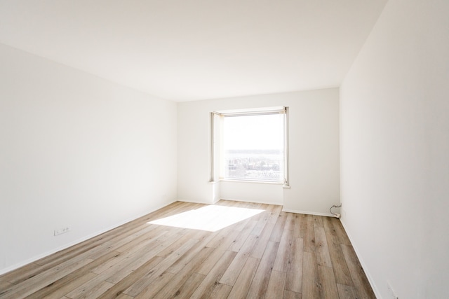 unfurnished room featuring light wood-style floors