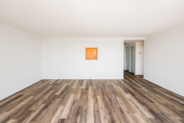 empty room with wood finished floors