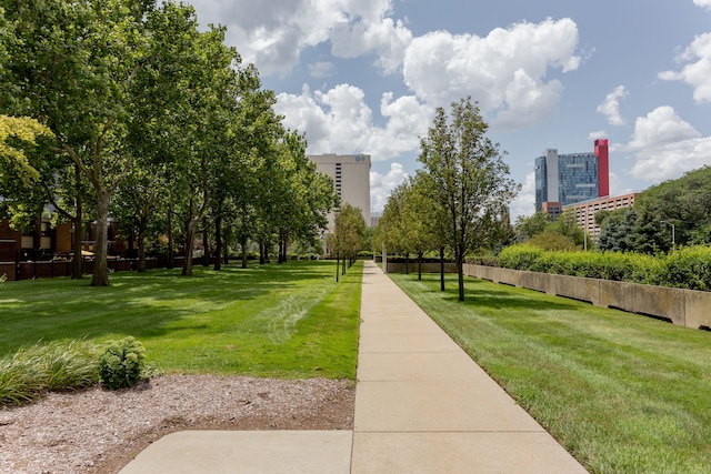 surrounding community featuring a lawn and a city view