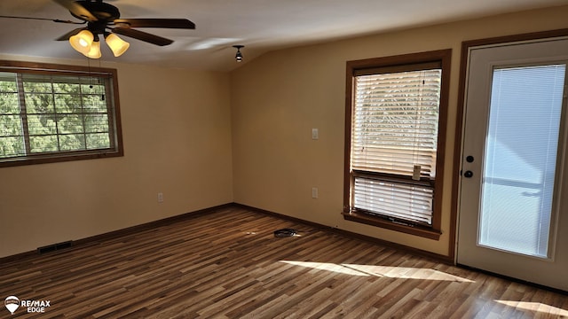unfurnished room featuring ceiling fan, dark wood-style floors, and baseboards