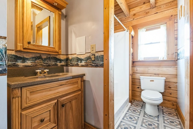 bathroom featuring vanity, toilet, and a shower with shower curtain