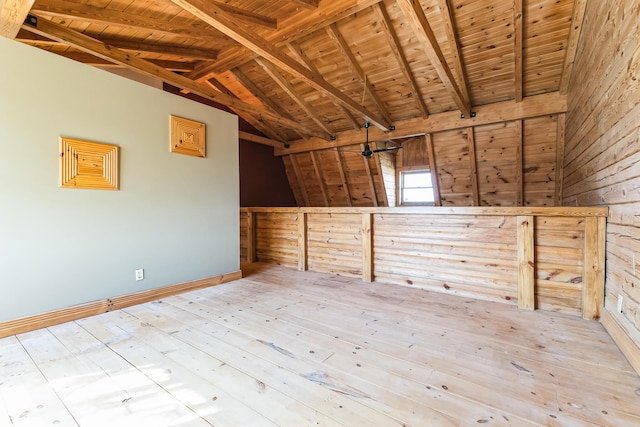 additional living space featuring wooden ceiling, vaulted ceiling with beams, and hardwood / wood-style flooring