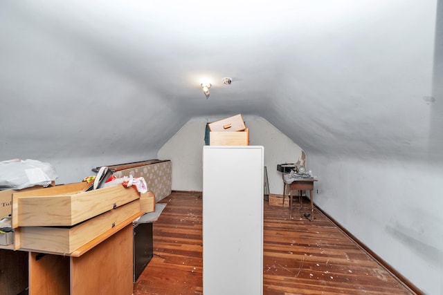 bonus room featuring lofted ceiling and hardwood / wood-style floors