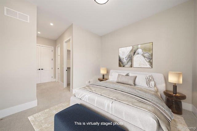 carpeted bedroom with a closet, visible vents, recessed lighting, and baseboards