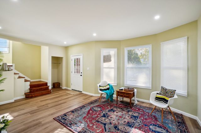3736 Iroquois St, Detroit, MI 48214 - sitting room with recessed lighting, stairs, baseboards, and wood finished floors