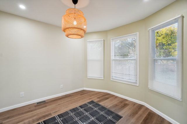 3736 Iroquois St, Detroit, MI 48214 - unfurnished room featuring visible vents, recessed lighting, baseboards, and wood finished floors