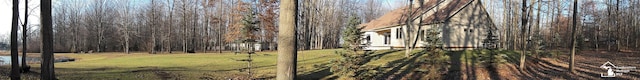 view of yard featuring a wooded view