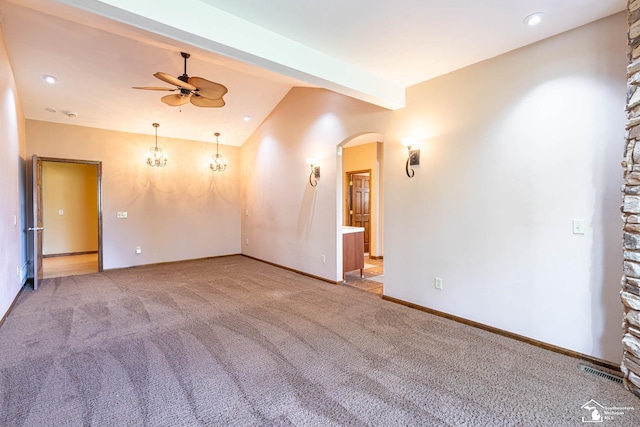 unfurnished room with ceiling fan, lofted ceiling with beams, carpet floors, arched walkways, and visible vents