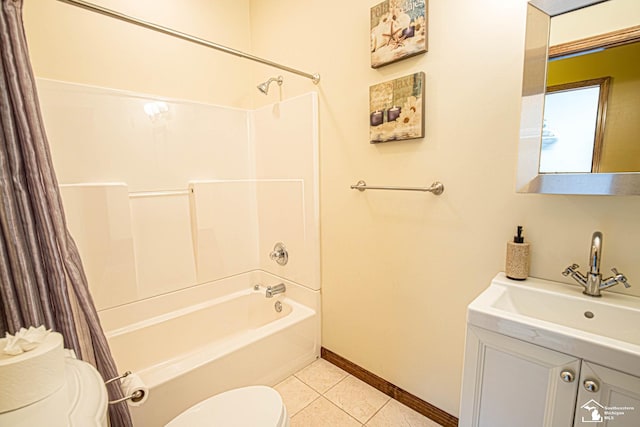 full bath with tile patterned flooring, vanity, toilet, shower / bath combo with shower curtain, and baseboards