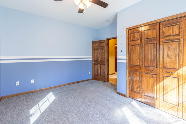 unfurnished bedroom with baseboards, ceiling fan, and light carpet