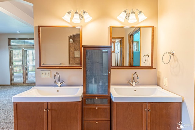 full bath featuring two vanities and a sink